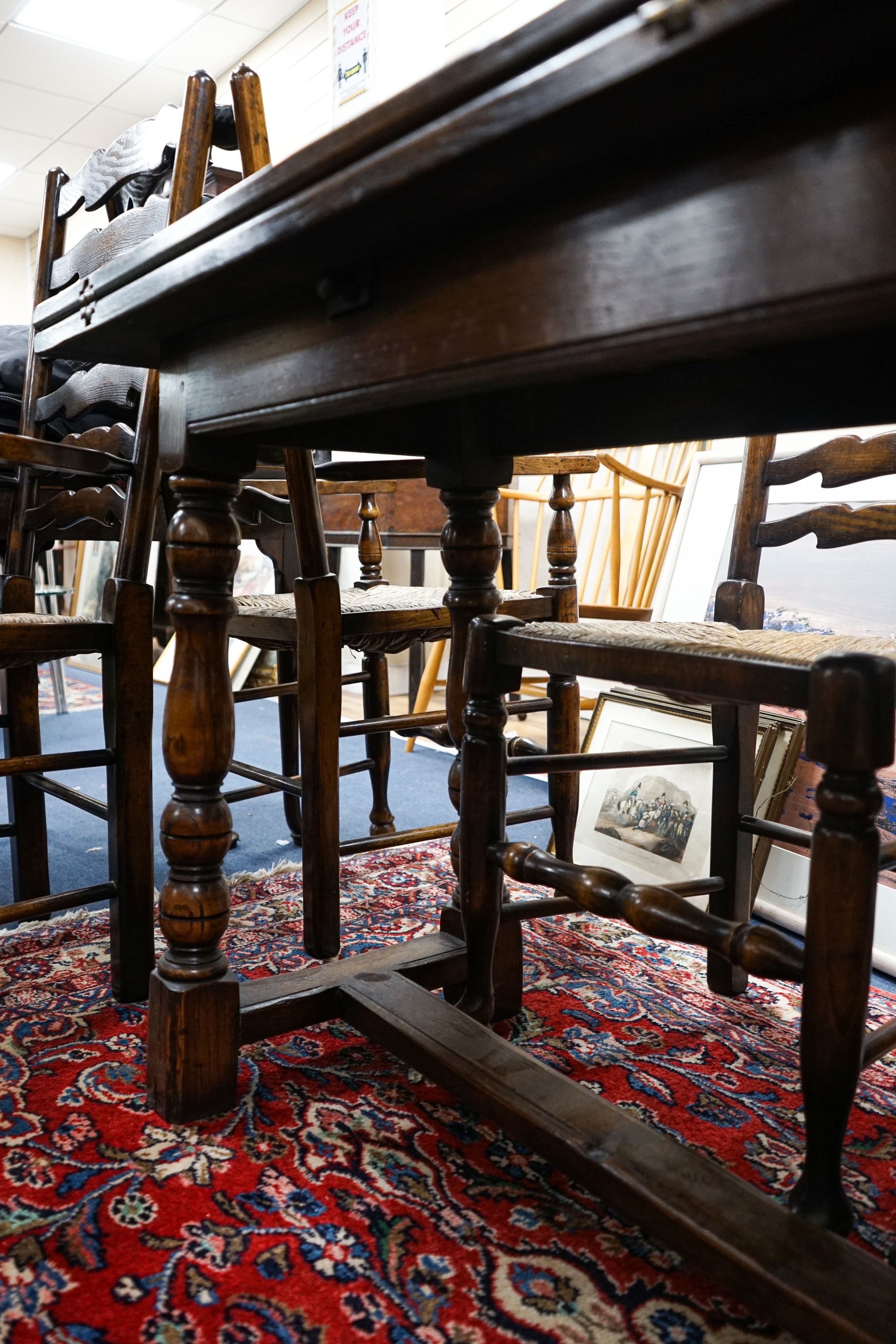 A Titchmarsh & Godwin 18th century style rectangular oak dining table with twin flap folding top, length 170cm extended, depth 99cm, height 74cm